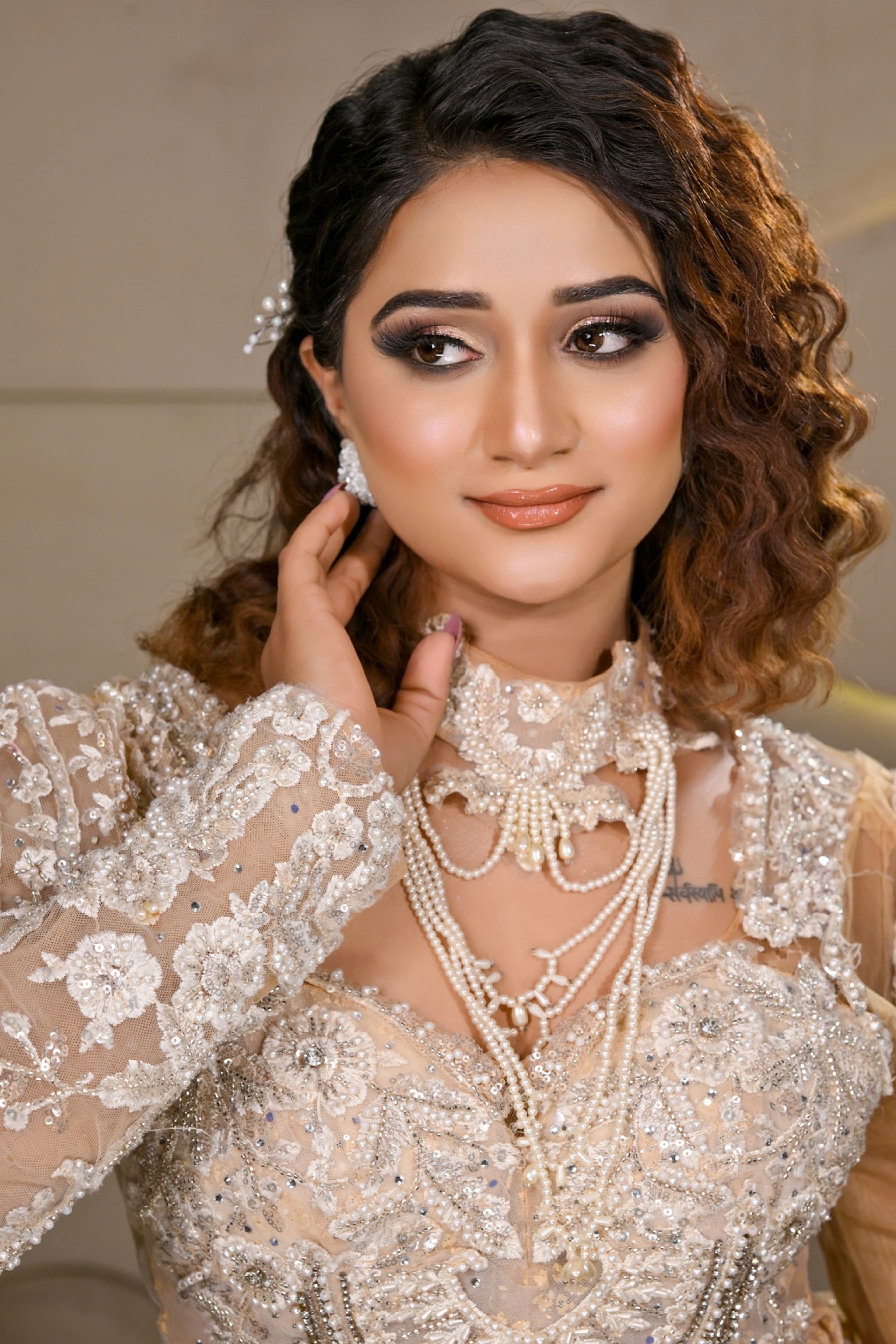 Classic bridal makeup with soft pink tones